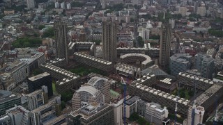 AX115_094 - 5.5K aerial stock footage approach Barbican Complex and London School for Girls, London England