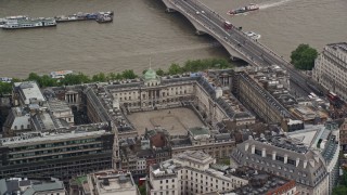 AX115_096E - 5.5K aerial stock footage orbiting Somerset House along River Thames, London England