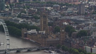 AX115_115 - 5.5K aerial stock footage of Big Ben and Parliament beside the river, London, England