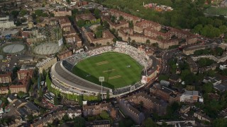 AX115_144E - 5.5K aerial stock footage of orbiting The Oval cricket stadium, London, England