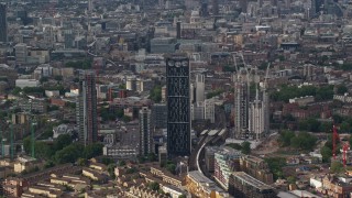 AX115_148 - 5.5K aerial stock footage of Strata Skyscraper among city buildings, London, England