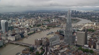 AX115_153E - 5.5K aerial stock footage of The Shard by the River Thames, reveal Tower Bridge, London, England