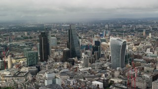 AX115_155 - 5.5K aerial stock footage of skyscrapers among cityscape, Central London, England