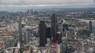 AX115_155E - 5.5K aerial stock footage of tall city skyscrapers and the vast cityscape, Central London, England