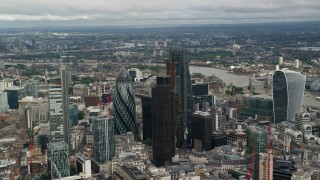 AX115_159 - 5.5K aerial stock footage of orbiting skyscrapers in Central London, England