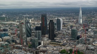 AX115_160 - 5.5K aerial stock footage of a view of skyscrapers and The Shard, Central London, England