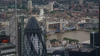 AX115_162E - 5.5K aerial stock footage flyby The Gherkin to reveal Tower Bridge, Central London, England