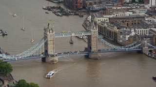 AX115_165E - 5.5K aerial stock footage of the Tower Bridge in London, England