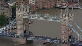 AX115_168E - 5.5K aerial stock footage of flying beside the Tower Bridge on the River Thames, London, England