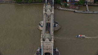 AX115_173E - 5.5K aerial stock footage of boats on River Thames passing under Tower Bridge, London, England