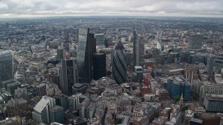 AX115_176 - 5.5K aerial stock footage of approaching The Gherkin and skyscrapers, London, England