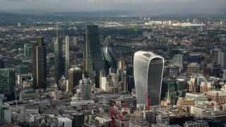 AX115_185 - 5.5K aerial stock footage of orbiting skyscrapers in Central London, England