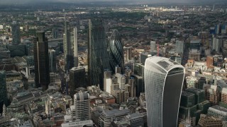 AX115_188 - 5.5K aerial stock footage of approaching The Gherkin and nearby skyscrapers, Central London, England