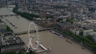 AX115_197 - 5.5K aerial stock footage of London Eye, Westminster Bridge, Big Ben and Parliament by the Thames, England