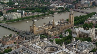 AX115_213 - 5.5K stock footage aerial video of approaching Big Ben and Parliament along the Thames, London, England