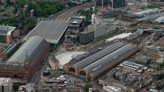 AX115_237 - 5.5K aerial stock footage approach the Kings Cross Train Station, London, England