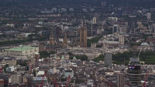 AX115_239E - 5.5K aerial stock footage of Big Ben and Parliament among city buildings, London, England