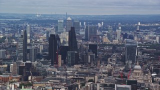 AX115_244E - 5.5K aerial stock footage of Canary Wharf and Central London skyscrapers, England
