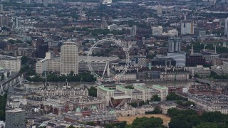 AX115_249 - 5.5K aerial stock footage of the London Eye and nearby city buildings, England
