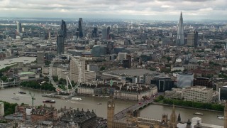 AX115_255 - 5.5K aerial stock footage of skyscrapers in Central London, London Eye and Parliament, England