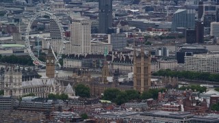 AX115_270 - 5.5K aerial stock footage of flying by Big Ben, Parliament and London Eye, England