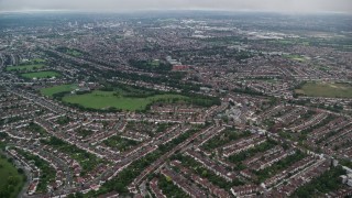 AX115_282E - 5.5K aerial stock footage fly over residential neighborhoods near Norbury Park, London, England