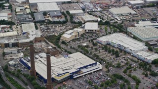 AX115_287E - 5.5K aerial stock footage of smoke stacks at the Valley Park Retail Area, Croydon, England
