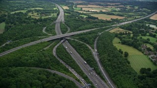 AX115_309E - 5.5K aerial stock footage of M23 and M25 freeway interchange in Redhill, England