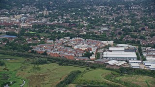 AX115_312E - 5.5K aerial stock footage of apartment buildings and warehouses, Redhill, England