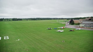 AX115_319 - 5.5K aerial stock footage of landing at an airport in Redhill, England