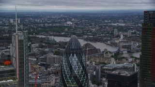 AX116_018E - 5.5K aerial stock footage flyby Heron Tower, reveal The Gherkin skyscraper, London, England, twilight