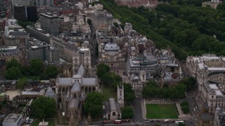 AX116_027 - 5.5K aerial stock footage fly over Westminster Abbey toward Westminster Central Hall, London, England, twilight