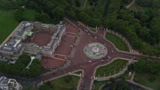 AX116_030 - 5.5K aerial stock footage of a bird's eye view of Buckingham Palace and Victoria Memorial, London, England, twilight