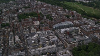 AX116_045E - 5.5K aerial stock footage of flying by office Buildings and Park House near Grosvenor Square, London, England, twilight
