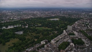 AX116_048 - 5.5K aerial stock footage of approaching Kensington Gardens in London, England, twilight