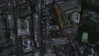 AX116_056 - 5.5K aerial stock footage of a bird's eye view over Oxford Street, reveal Central St Giles, London, England, twilight