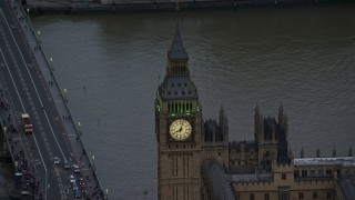AX116_063 - 5.5K stock footage aerial video orbiting Big Ben orbiting River Thames, London England, twilight