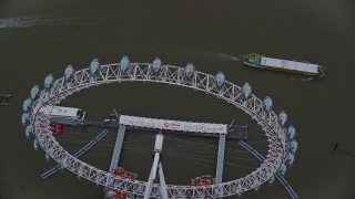 AX116_078 - 5.5K aerial stock footage of orbiting the London Eye on the River Thames, London, England, twilight