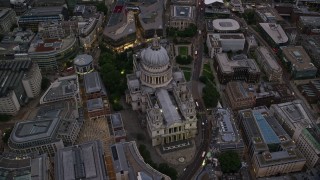 AX116_082E - 5.5K aerial stock footage of approaching St Paul's Cathedral, London, England, twilight