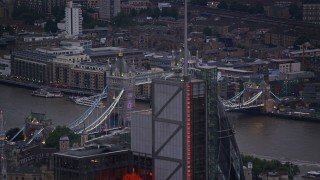 AX116_088E - 5.5K aerial stock footage flyby 122 Leadenhall Street to reveal Tower Bridge and River Thames, London, England, twilight