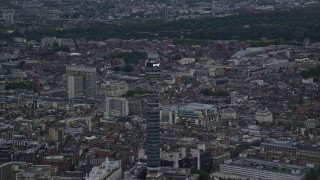 AX116_097 - 5.5K aerial stock footage of flying by BT Tower, London, England, twilight