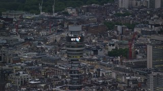 AX116_098 - 5.5K aerial stock footage of an orbit of the top of BT Tower, London, England, twilight