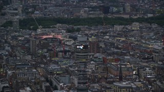 AX116_099 - 5.5K aerial stock footage of circling the top of BT Tower, London, England, twilight