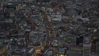 AX116_101E - 5.5K aerial stock footage of zooming in on Regent Street, London, England, night