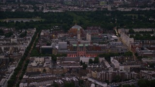 AX116_126 - 5.5K aerial stock footage of Royal Albert Hall, Queen's Tower, and Natural History Museum, London, England, night