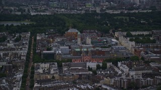 AX116_126E - 5.5K aerial stock footage of Royal Albert Hall, Queen's Tower, and Natural History Museum, London, England, night