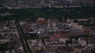 AX116_127 - 5.5K aerial stock footage flyby Royal Albert Hall, Queen's Tower, Natural History Museum in London, England, night