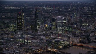 AX116_148 - 5.5K aerial stock footage of passing by Central London Skyscrapers, London, England, night