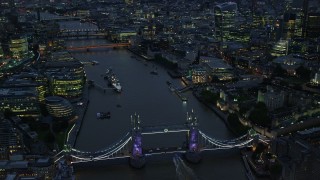 AX116_157E - 5.5K aerial stock footage orbiting Tower Bridge and River Thames near Tower of London, England, night