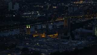 AX116_181 - 5.5K aerial stock footage of flying by Big Ben and British Parliament, London, England, night